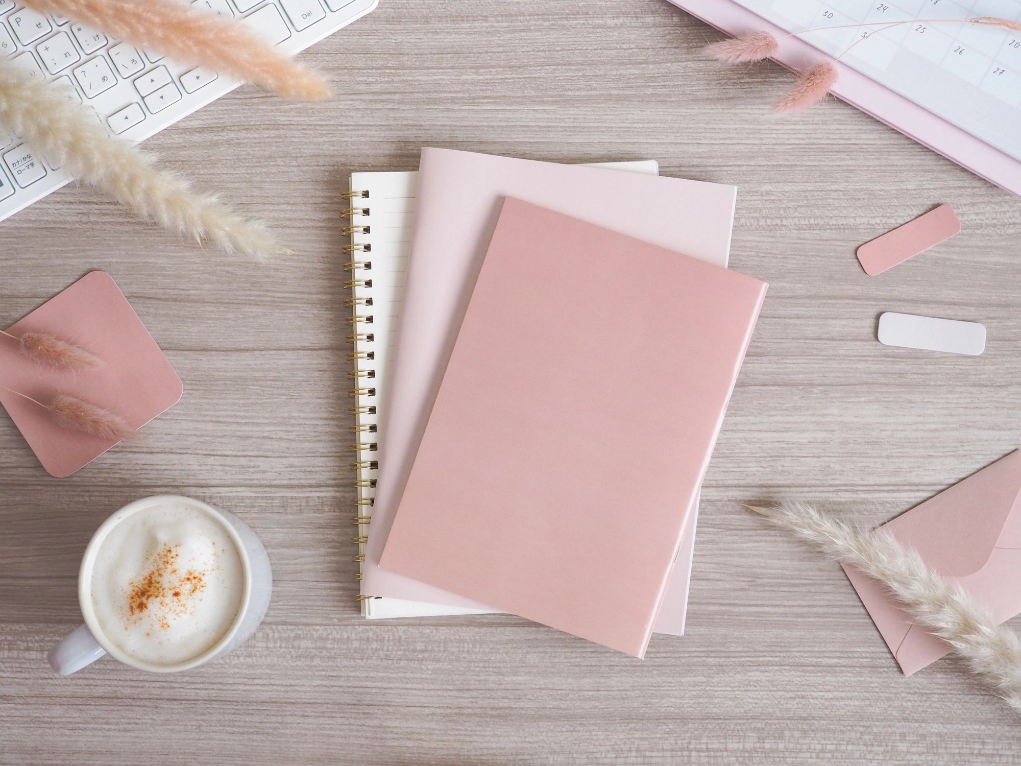 Soft, feminine workspace flat lay in pink and neutral tones