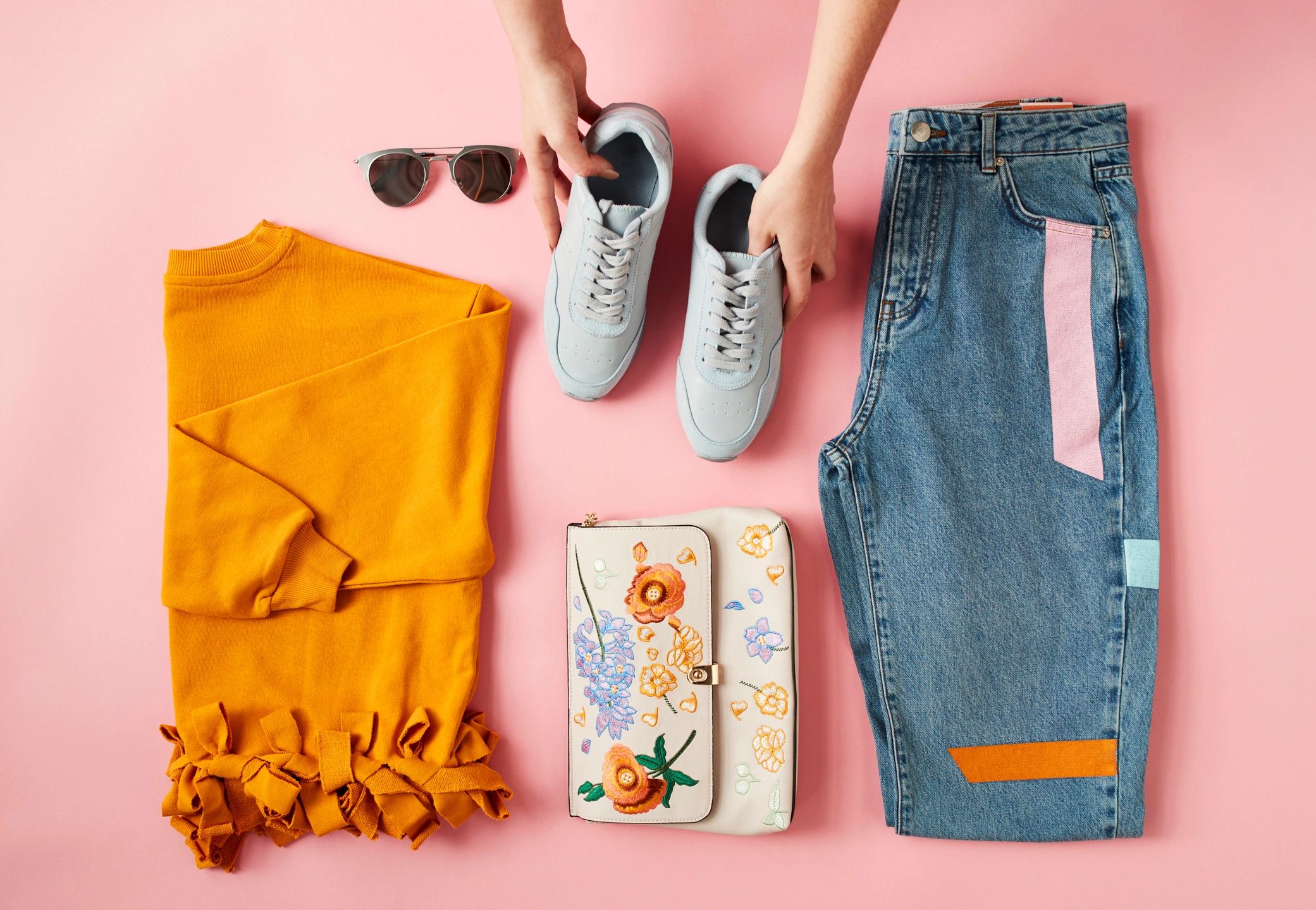 Flat lay of autumn clothing being arranged